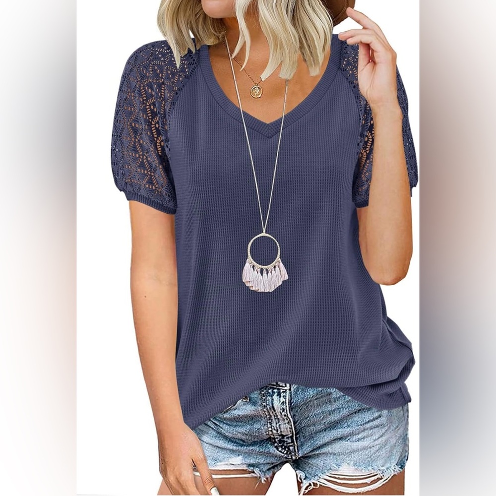NWT Navy blue blouse with lace type details on the sleeves